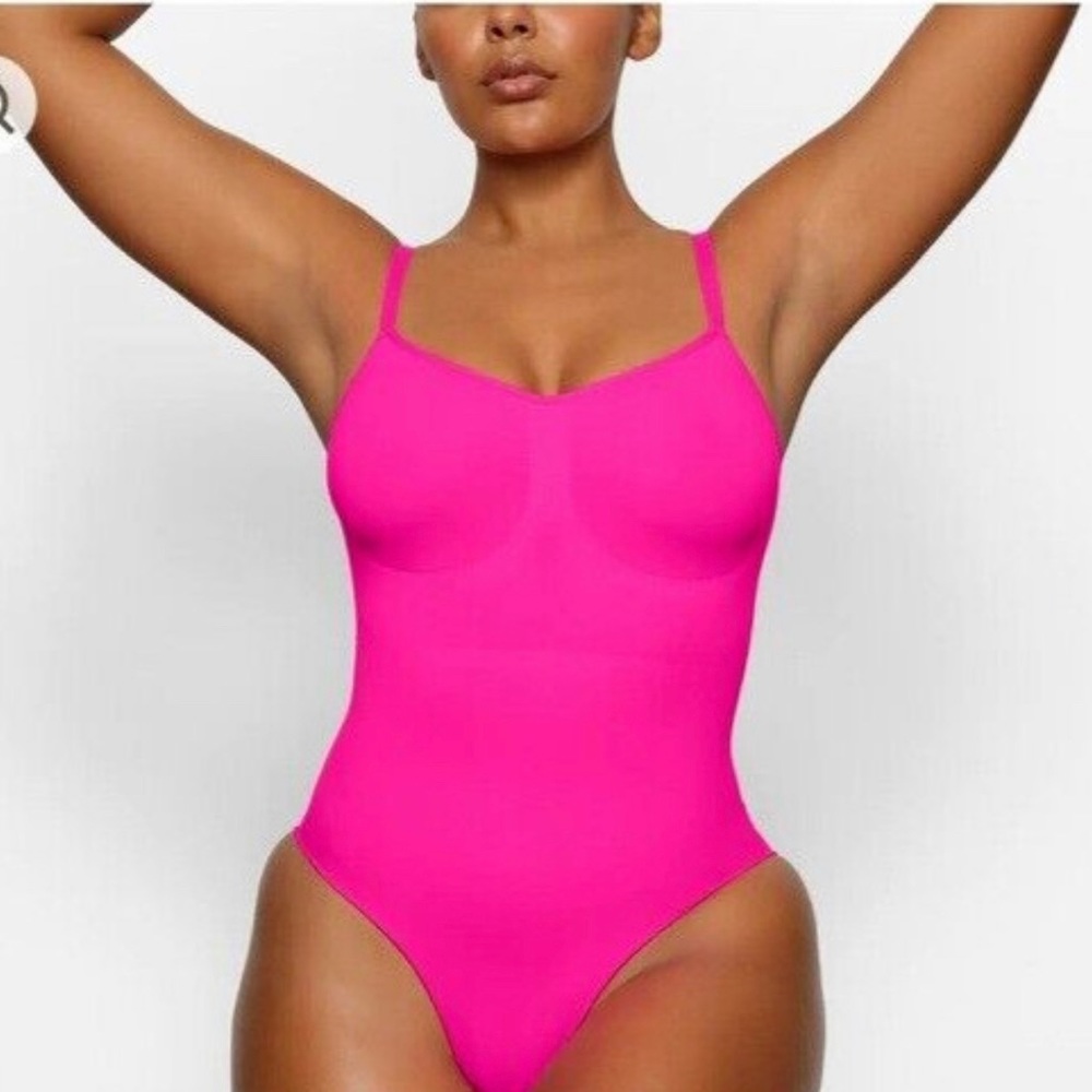 Skins bodysuit in sold out color “flamingo”